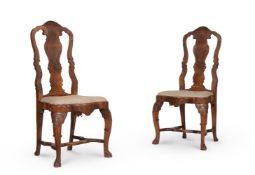 A PAIR OF DUTCH CARVED AND FIGURED WALNUT SIDE CHAIRS IN 18TH CENTURY STYLE