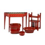 A GROUP OF RED PAINTED AND LACQUERED ITEMS