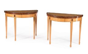 Y A PAIR OF SATINWOOD, ROSEWOOD CROSS BANDED AND POLYCHROME DECORATED DEMI-LUNE FOLDING CARD TABLES