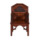 A VICTORIAN PITCH PINE THRONE ARMCHAIR, BY COX & SONS