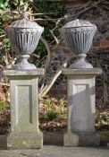 A PAIR OF LEAD URNS AND COVERS, IN THE GEORGE III ADAM STYLE