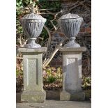 A PAIR OF LEAD URNS AND COVERS, IN THE GEORGE III ADAM STYLE