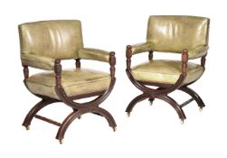 A PAIR OF WALNUT AND LEATHER UPHOLSTERED LIBRARY ARMCHAIRS