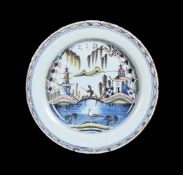 AN ENGLISH DELFT POLYCHROME CHINOISERIE CHARGER