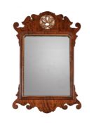 A GEORGE III WALNUT AND PARCEL GILT FRETWORK WALL MIRROR