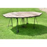 A LARGE WROUGHT IRON AND WOOD GARDEN TABLE
