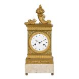 A FRENCH GILT METAL MANTEL CLOCK