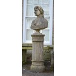 A CARVED STONE BUST OF A YOUNG WOMAN ON PEDESTAL BASE