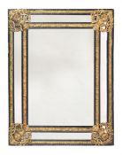 A CONTINENTAL EBONISED AND GILT METAL MOUNTED WALL MIRROR, SECOND HALF 19TH CENTURY