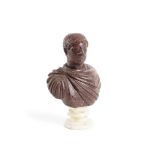 A CARVED RED PORPHYRY BUST OF EMPEROR HADRIAN, ITALIAN, POSSIBLY 20TH CENTURY