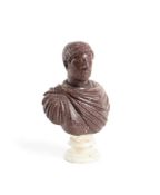 A CARVED RED PORPHYRY BUST OF EMPEROR HADRIAN, ITALIAN, POSSIBLY 20TH CENTURY