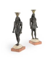 A PAIR OF BRONZE CANDLESTICKS IN THE FORM OF ANTINOUS AS OSIRIS, ITALIAN OR FRENCH, 19TH CENTURY