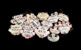 A GROUP OF SEVENTEEN ENAMELLED WINE AND LIQUOR LABELS, PREDOMINATELY EARLY 20TH CENTURY