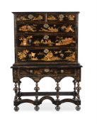 A QUEEN ANNE BLACK LACQUER AND GILT CHINOISERIE DECORATED CHEST ON STAND, EARLY 18TH CENTURY