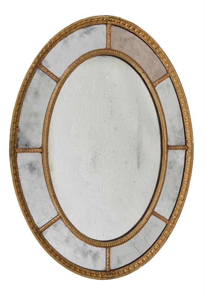 A GILTWOOD AND GESSO OVAL WALL MIRROR, LATE 18TH/EARLY 19TH CENTURY
