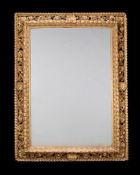 A LARGE CONTINENTAL CARVED GILTWOOD MIRROR, 19TH CENTURY