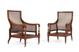 A PAIR OF REGENCY MAHOGANY AND CANED LIBRARY BERGERE ARMCHAIRS, CIRCA 1815