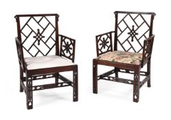A PAIR OF GEORGE III MAHOGANY COCKPEN ARMCHAIRS, IN THE CHINESE CHIPPENDALE MANNER, CIRCA 1770