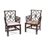 A PAIR OF GEORGE III MAHOGANY COCKPEN ARMCHAIRS, IN THE CHINESE CHIPPENDALE MANNER, CIRCA 1770