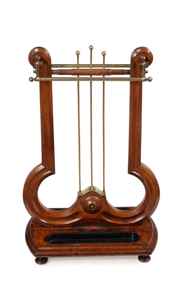 AN EARLY VICTORIAN OAK AND BRASS STICK STAND, CIRCA 1840