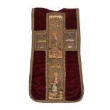 A CHASUBLE FRAGMENT, THE RED VELVET FIELD WITH EARLIER ORPHREY WOVEN WITH TWO SAINTS