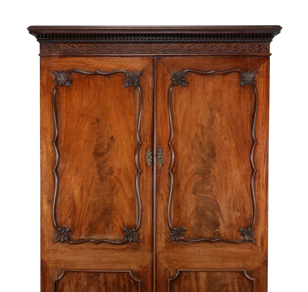 A GEORGE III MAHOGANY WARDROBE, IN THE MANNER OF THOMAS CHIPPENDALE, CIRCA 1770 - Image 2 of 6