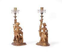 A PAIR OF CARVED GILTWOOD FIGURAL CANDLESTICKS, EARLY 19TH CENTURY