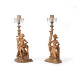 A PAIR OF CARVED GILTWOOD FIGURAL CANDLESTICKS, EARLY 19TH CENTURY