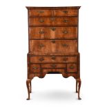 A GEORGE I WALNUT CHEST ON STAND, CIRCA 1730