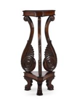 AN ANGLO INDIAN PADOUK TRIFORM PEDESTAL STAND, IN REGENCY STYLE, 19TH CENTURY