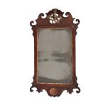 A GEORGE II MAHOGANY AND PARCEL GILT WALL MIRROR, MID 18TH CENTURY