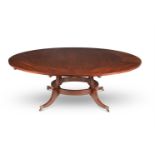 A MAHOGANY CIRCULAR CONCENTRIC EXTENDING DINING TABLE, BY ARTHUR BRETT