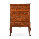 A GEORGE II WALNUT CHEST ON STAND, CIRCA 1740