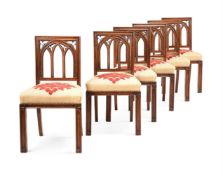 A SET OF SIX WALNUT DINING CHAIRS, IN GOTHIC REVIVAL STYLE, FIRST HALF 19TH CENTURY