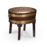 A GEORGE III MAHOGANY AND BRASS BOUND WINE COOLER, CIRCA 1760