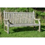 A HARDWOOD BENCH BY BARNSLEY HOUSE, 20TH CENTURY