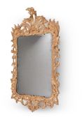 A GEORGE II CARVED GILTWOOD WALL MIRROR, MID 18TH CENTURY