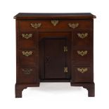 A GEORGE III MAHOGANY COMBINED KNEEHOLE DESK AND DRESSING TABLE, CIRCA 1760