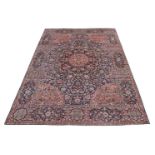 A KIRMAN CARPET, approximately 495 x 350cm