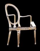 A GEORGE III CREAM PAINTED AND PARCEL GILT ELBOW CHAIR, IN THE MANNER OF THOMAS CHIPPENDALE