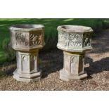 A PAIR OF CAST STONE PLANTERS AND PEDESTALS, IN THE GOTHIC STYLE, 20TH CENTURY