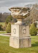 A LARGE CAST STONE WARWICK VASE AND PEDESTAL, IN THE MANNER OF COADE