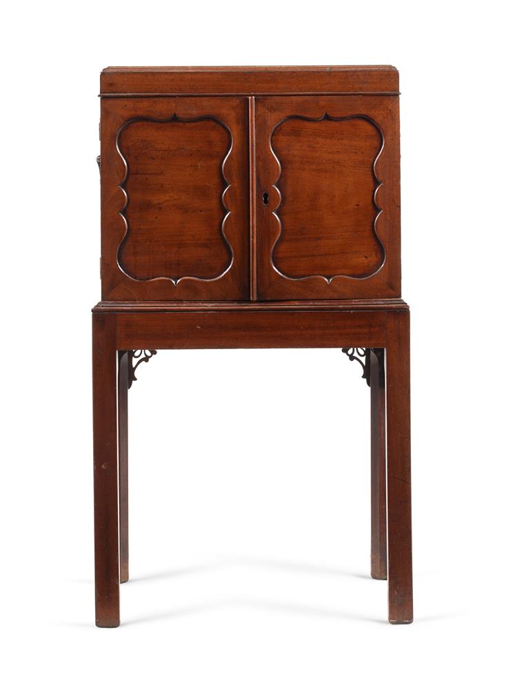 A GEORGE III MAHOGANY CABINET ON STAND, CIRCA 1770