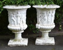 A PAIR OF CAST STONE URNS IN THE FORM OF THE MEDICI VASE, 20TH CENTURY