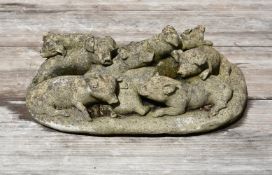A COMPOSITION STONE GROUP OF PIGLETS, PROBABLY 1920