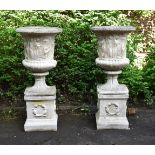 A PAIR OF LARGE CAST STONE URNS IN THE FORM OF THE MEDICI VASE, 20TH CENTURY