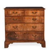 A GEORGE II WALNUT AND LINE INLAID CHEST OF DRAWERS, CIRCA 1730