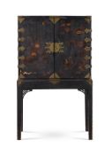 A BLACK AND GILT JAPANNED CABINET ON STAND, 18TH CENTURY AND LATER