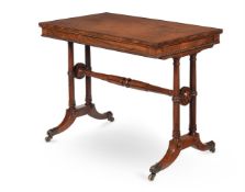 Y A REGENCY ROSEWOOD WRITING TABLE, IN THE MANNER OF GEORGE BULLOCK, CIRCA 1815