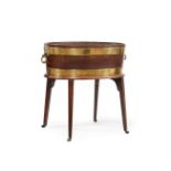 A GEORGE III MAHOGANY AND BRASS BOUND WINE COOLER, IN THE MANNER OF THOMAS CHIPPENDALE